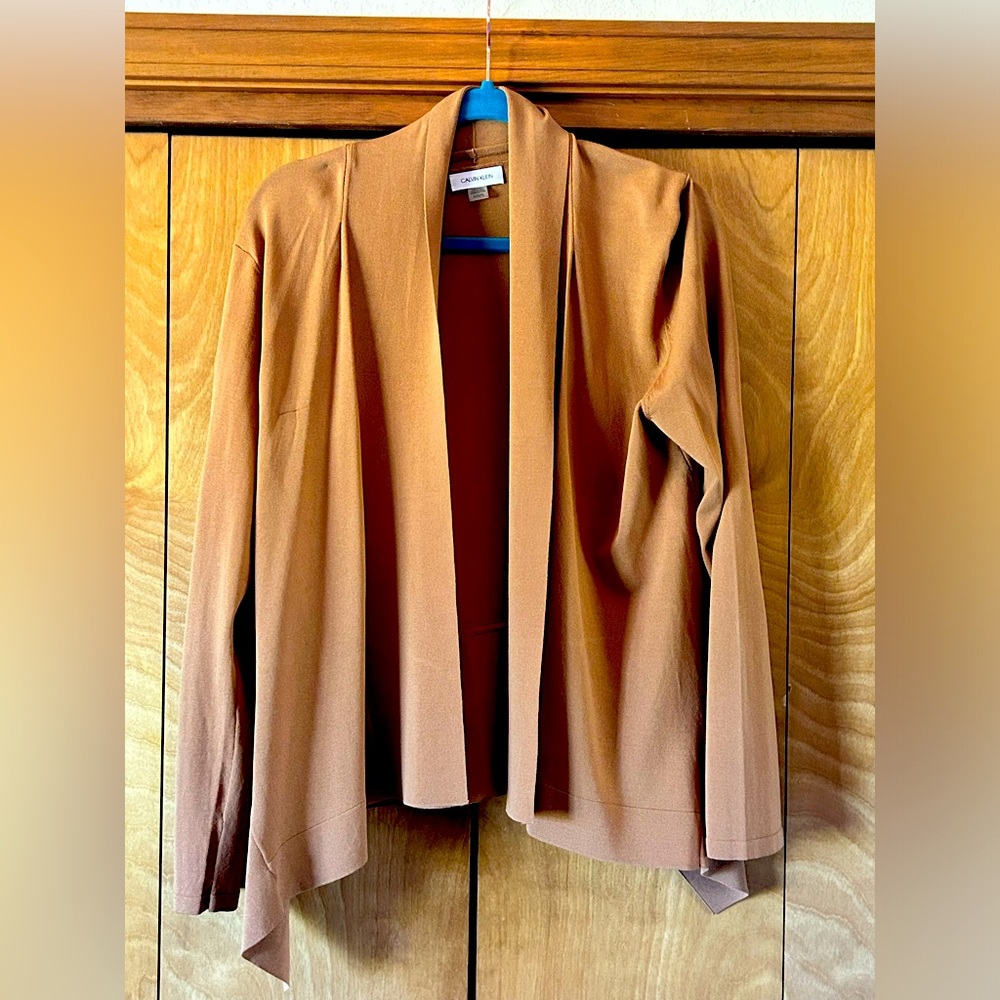 Light brown, tailored cardigan by Calvin Klein.